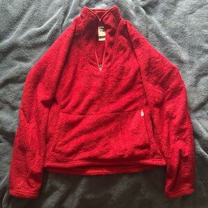 Red North Face 1/4 zip pullover with a kangaroo pocket